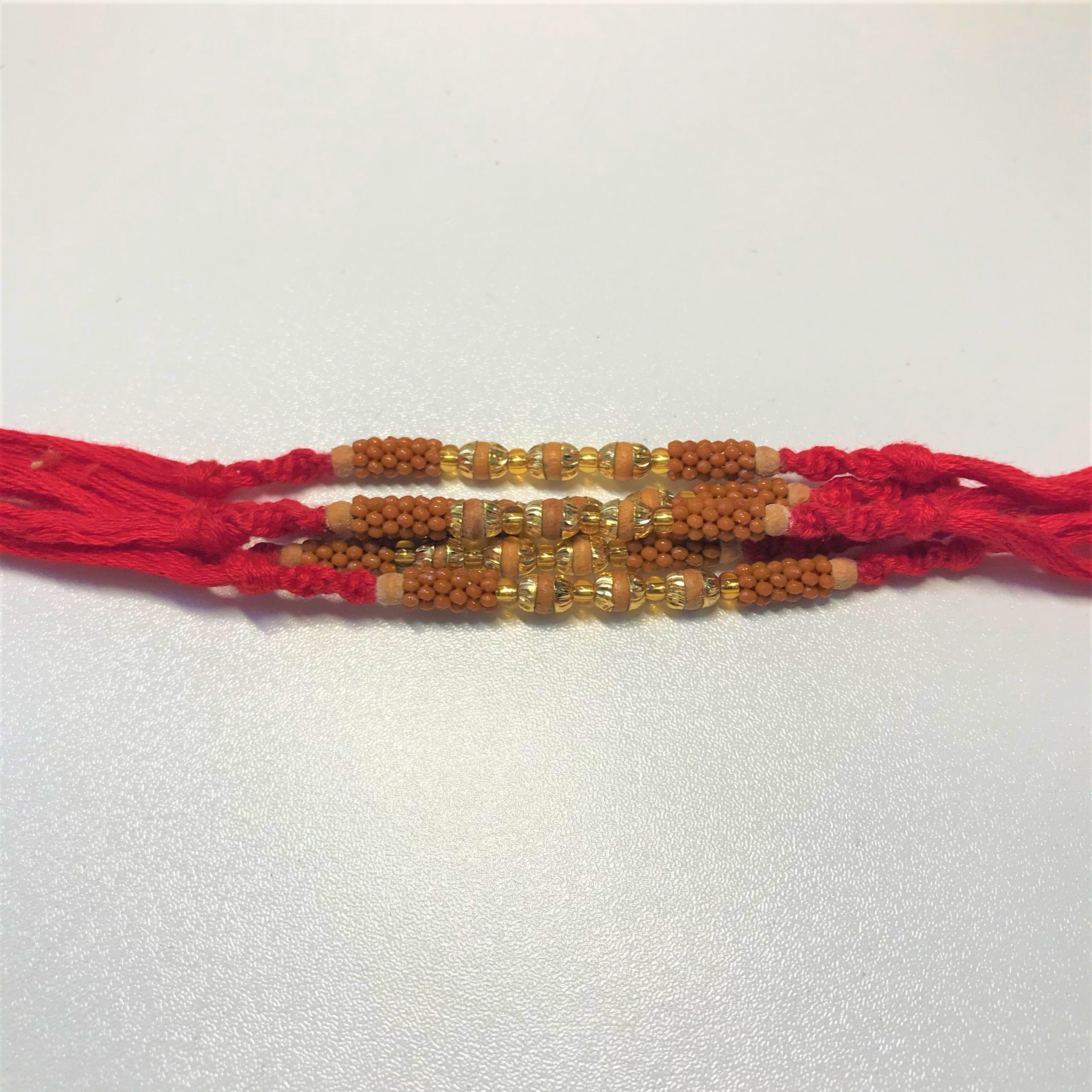 Tulsi/Basil Rakhi With brown beads by Teknowear